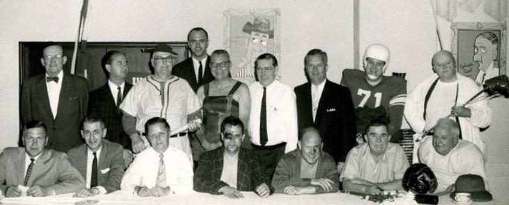 A group of people sitting at a table.