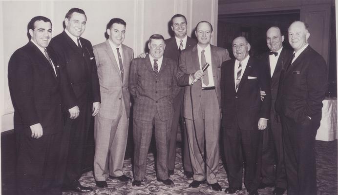 A group of men standing next to each other.