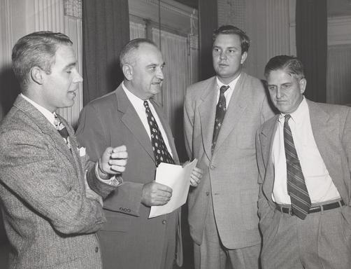 A group of men standing next to each other.